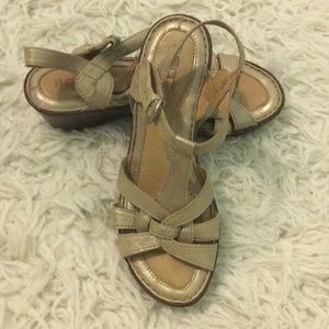 Metallic gold Born wedge sandals in size 7/38